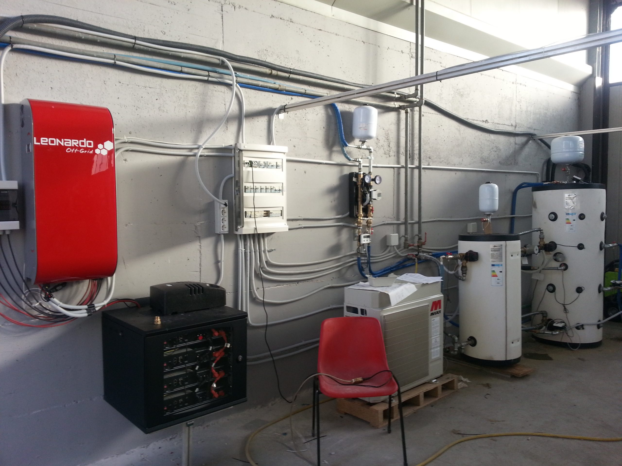 NanoCog hybrid domestic energy installation with electrical controls, battery storage, heat pumps, and thermal storage tanks